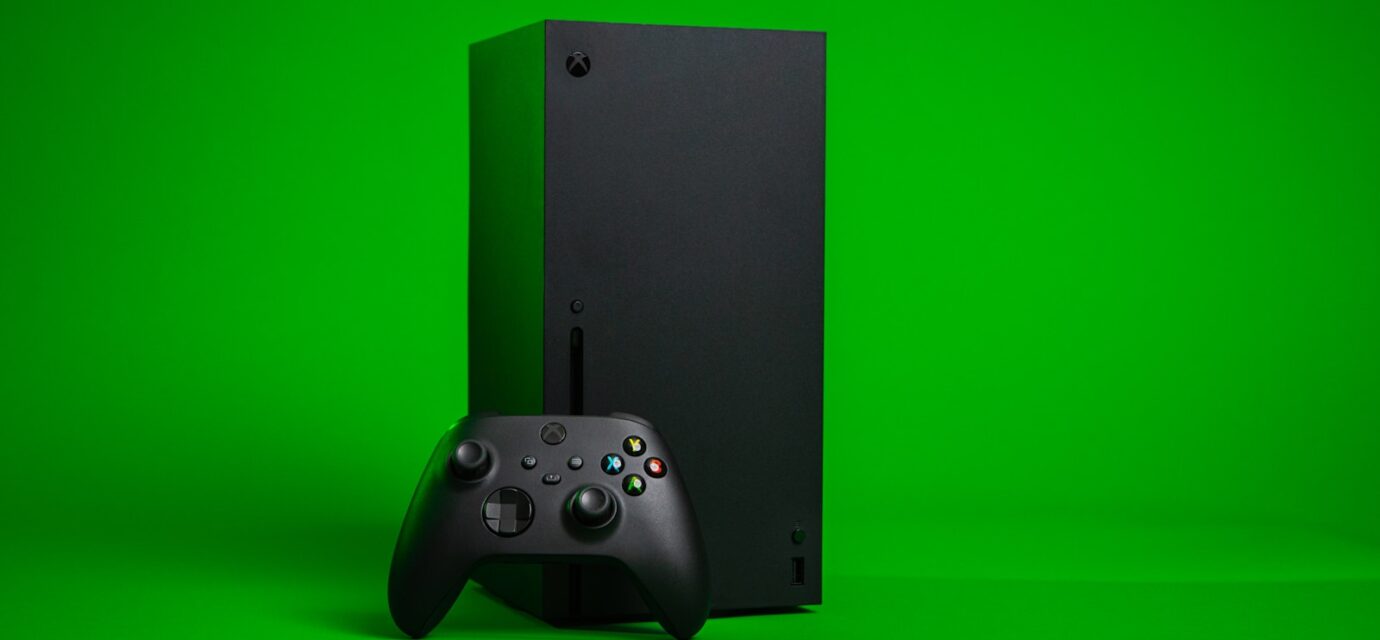 black xbox one console with controller