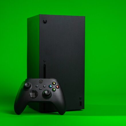 black xbox one console with controller