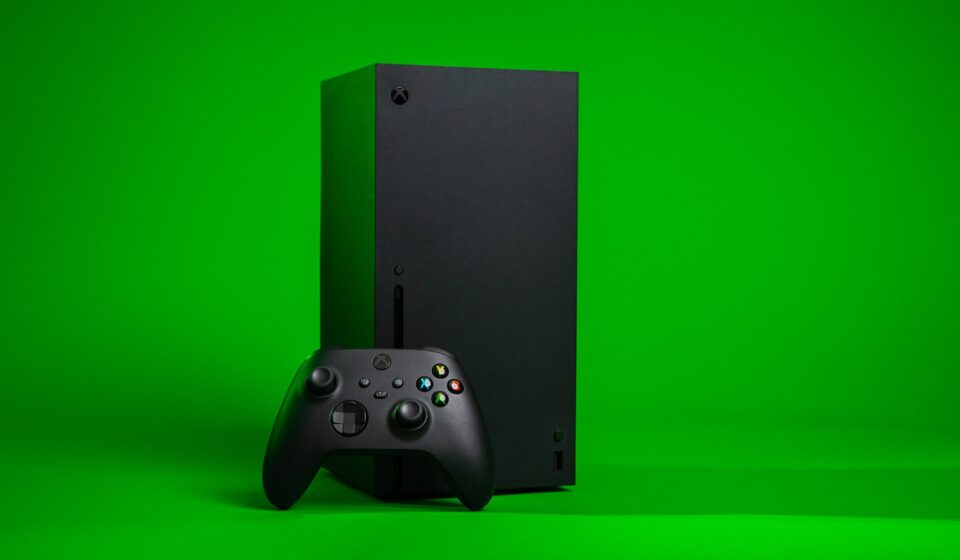 black xbox one console with controller