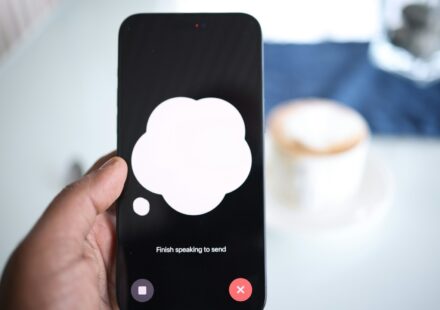 a person holding a cell phone with a speech bubble on the screen