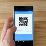 black android smartphone displaying qr code