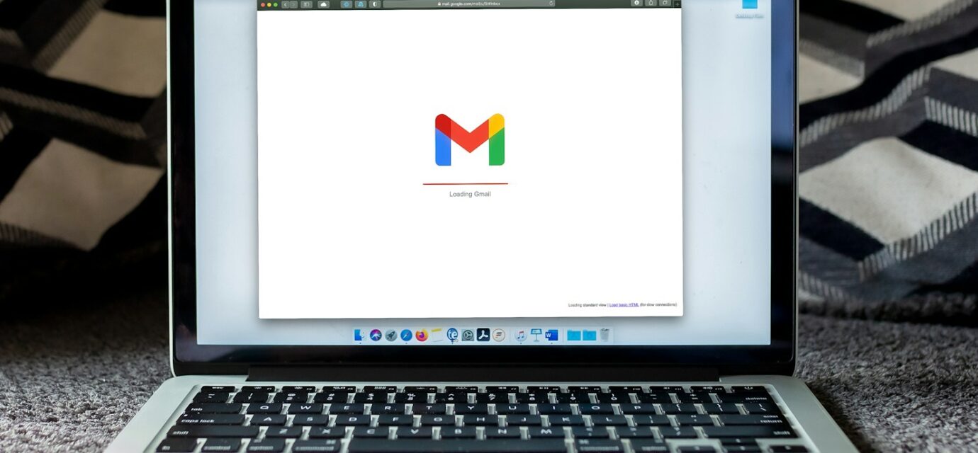 macbook pro on black textile