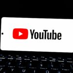 Youtube logo displayed on a smartphone screen.