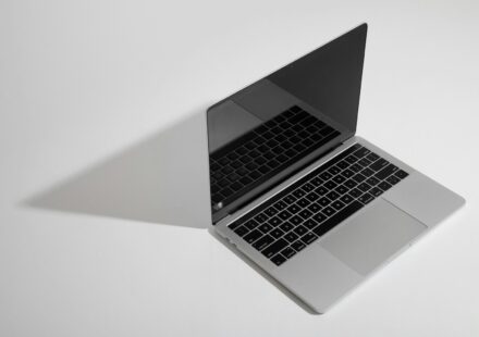 macbook pro on white table
