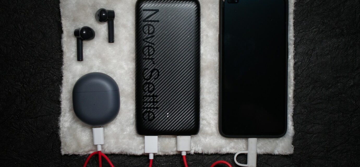 black iphone 5 c beside white usb cable