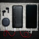 black iphone 5 c beside white usb cable