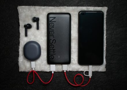 black iphone 5 c beside white usb cable