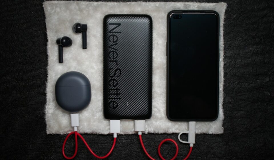 black iphone 5 c beside white usb cable