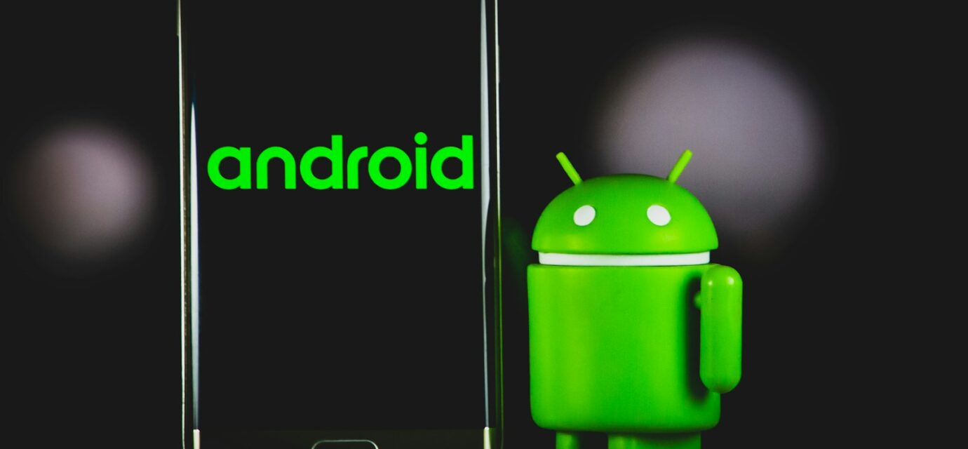 green frog iphone case beside black samsung android smartphone