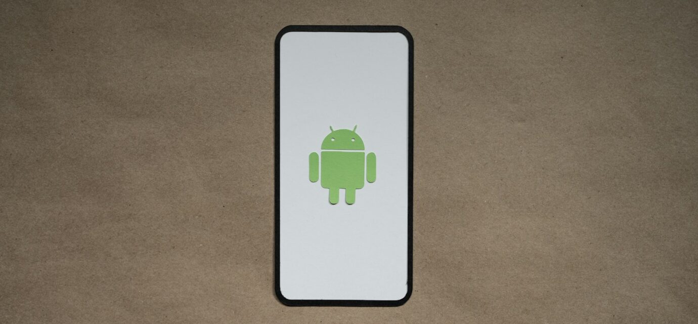 a cell phone with a green icon on it