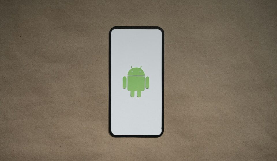 a cell phone with a green icon on it