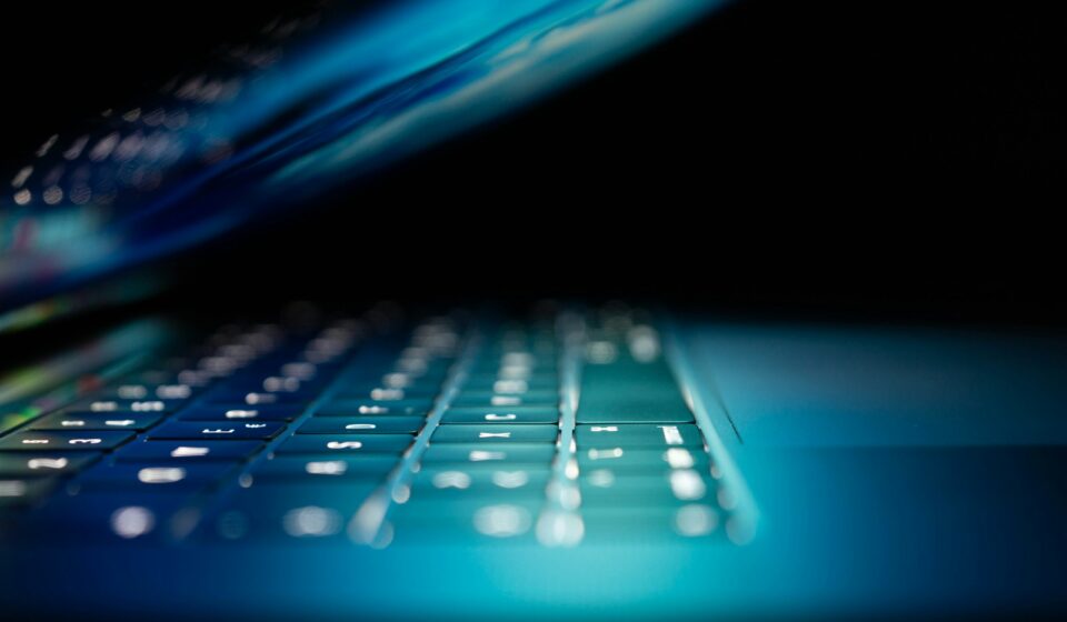 closeup photo of turned-on blue and white laptop computer