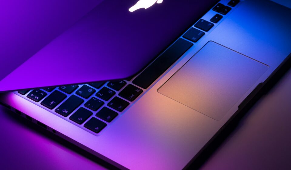 slightly opened silver MacBook