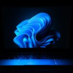 a macbook air laptop in the dark