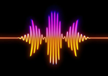A colorful sound wave on a black background
