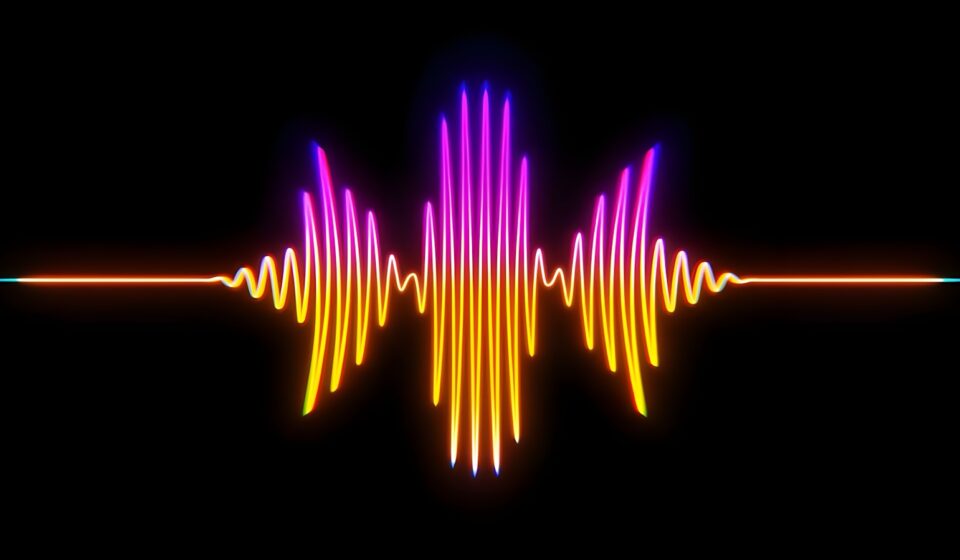 A colorful sound wave on a black background