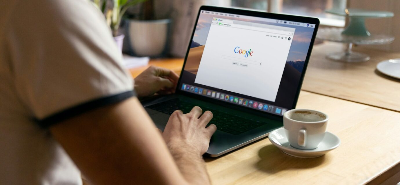 person using black laptop computer