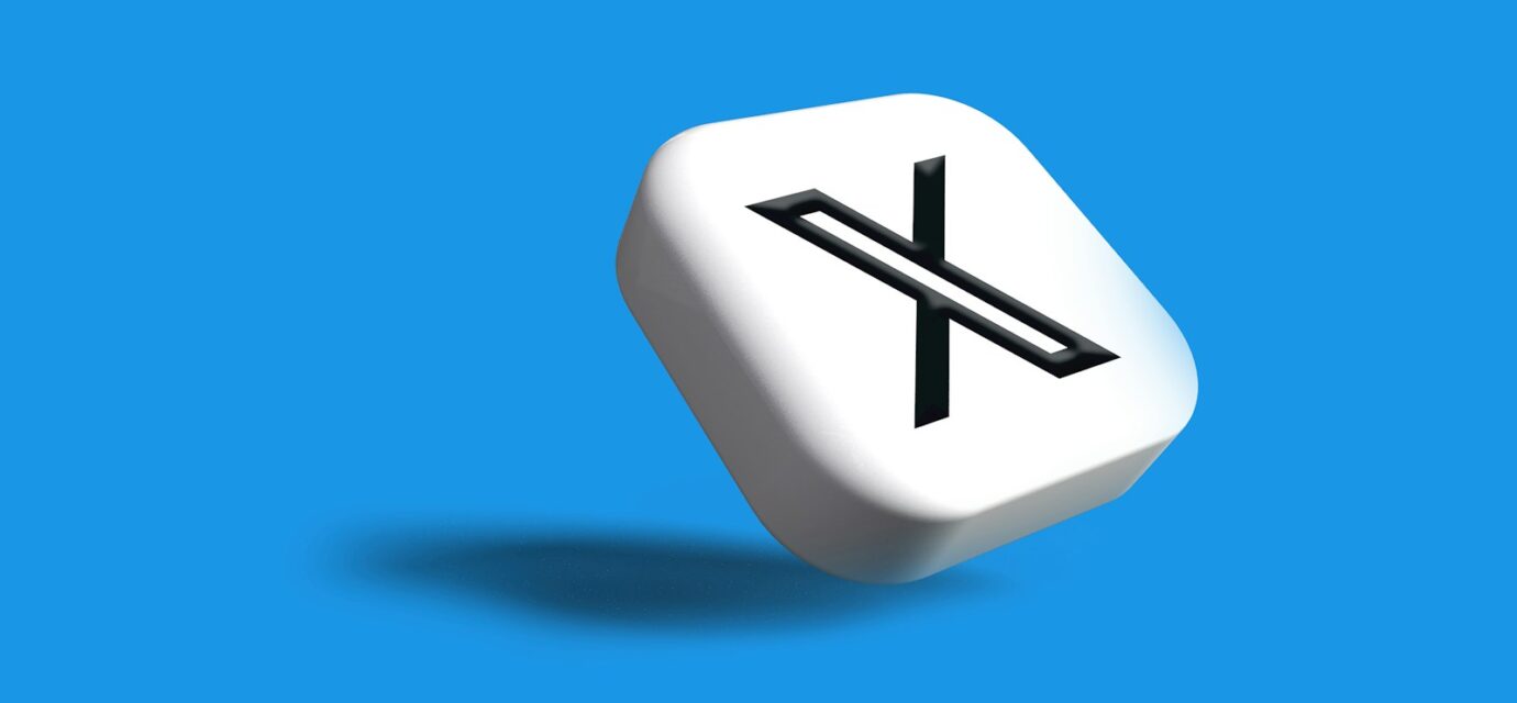 a white dice with a black x on it