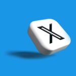 a white dice with a black x on it