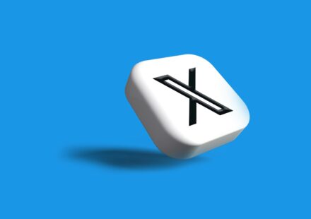 a white dice with a black x on it