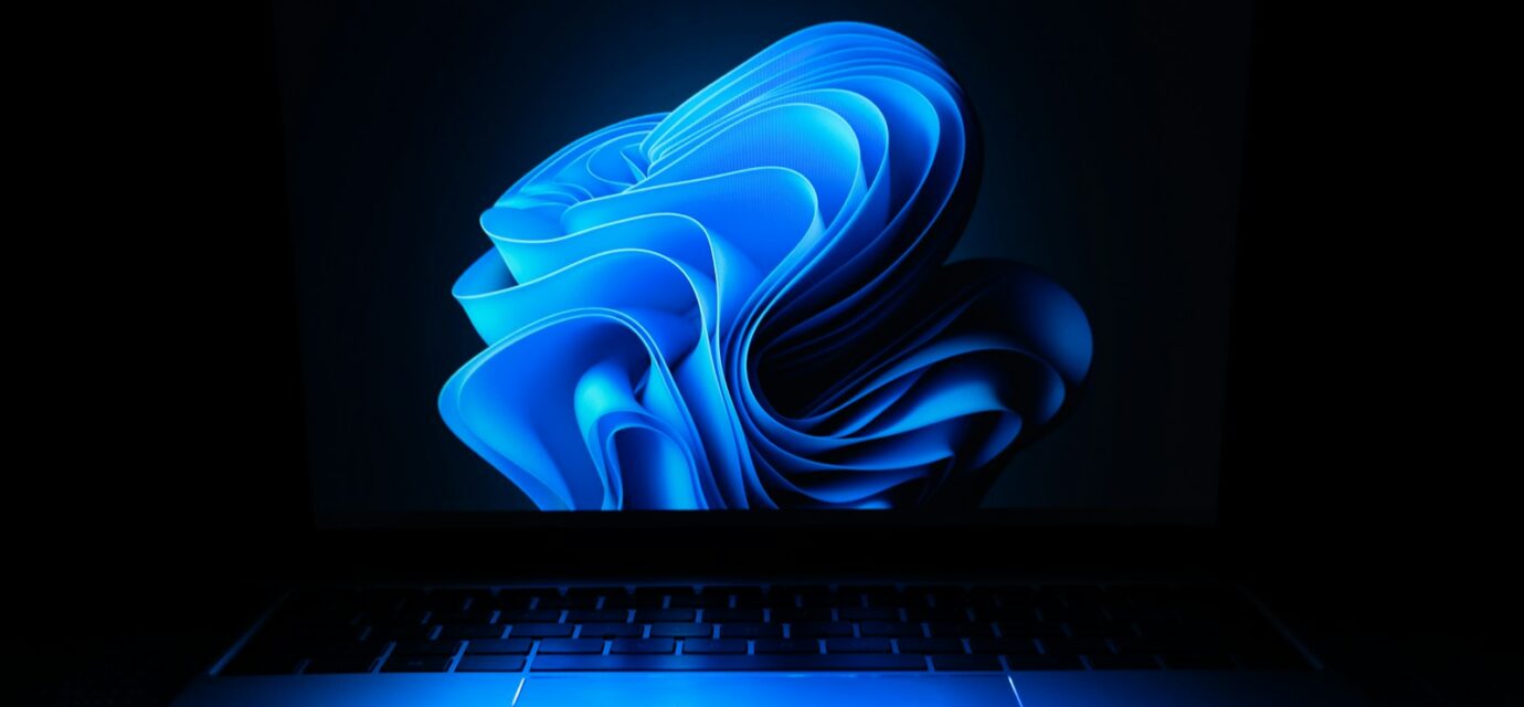 a macbook air laptop in the dark