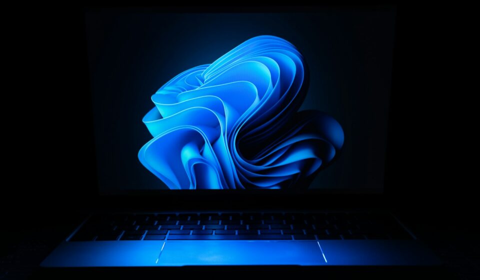 a macbook air laptop in the dark