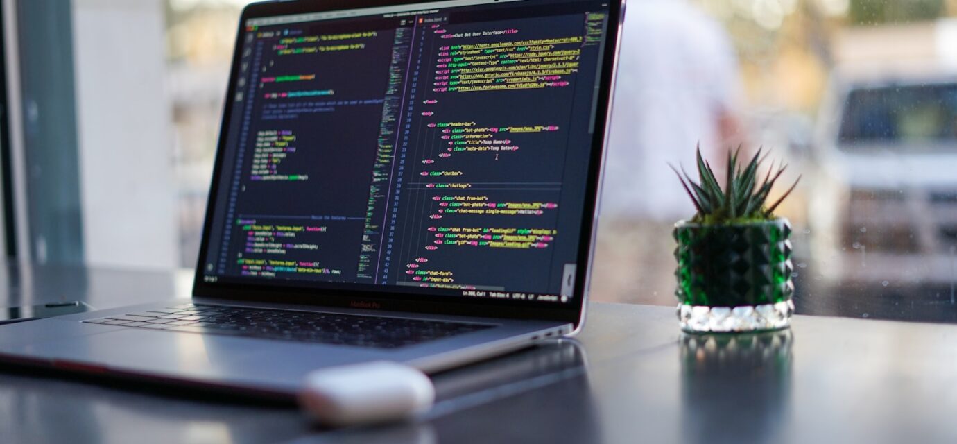 black laptop computer turned on on table